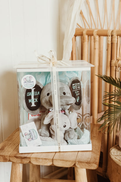 Tiny Firsts Bundle gift box fully packed with personalised elephant keepsake, onesie, comforter, teether and contrast cards