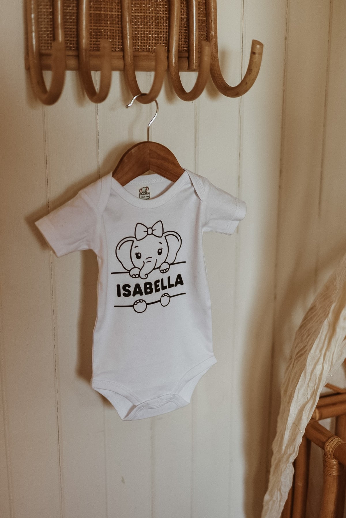 Personalised cotton baby onesie with elephant print and baby's name
